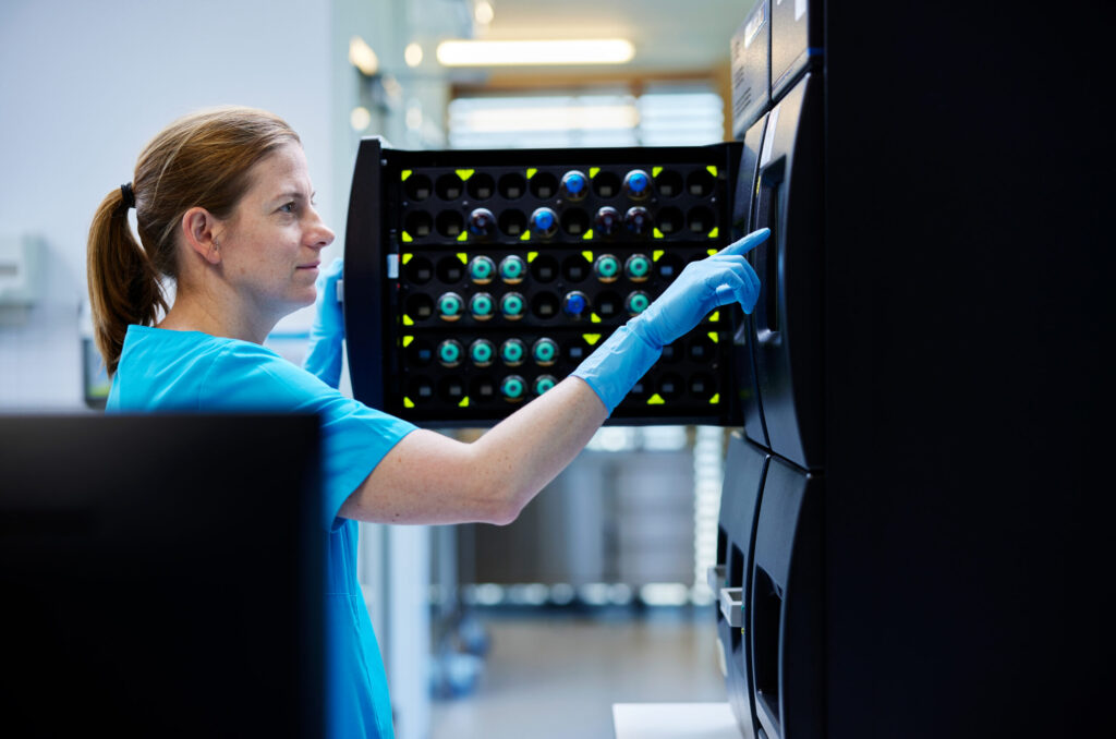 Beyond the benchmark: How an adaptive approach drives scientific discovery scientist opening storage cabinet door in laboratory